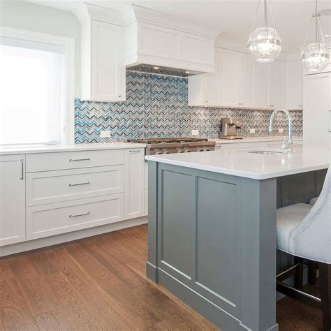 blue backsplash with white cabinets